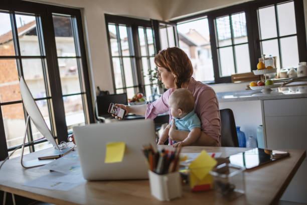 istock Mother with baby working from Home 1215999666