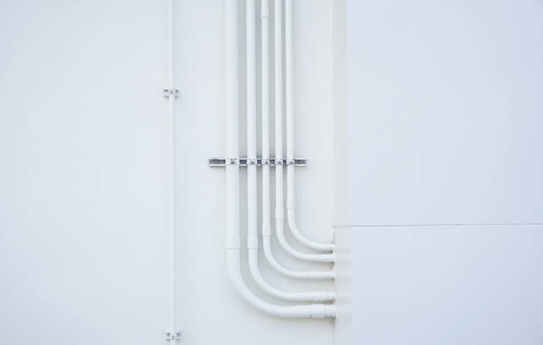 Pipe line outside the building Closeup medical pipe line outside the building hospital on white wall background. pvc conduit stock pictures, royalty-free photos & images