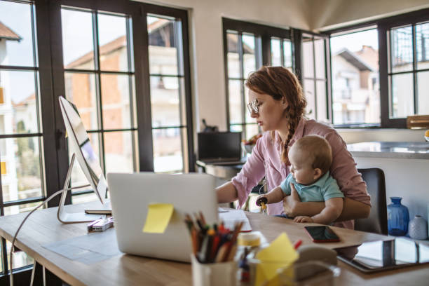 istock Mother with baby working from Home 1216000021