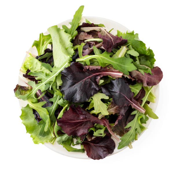 istock Salad leaves arugula and red beetroot in a plate on a white. The view from top 1216003512
