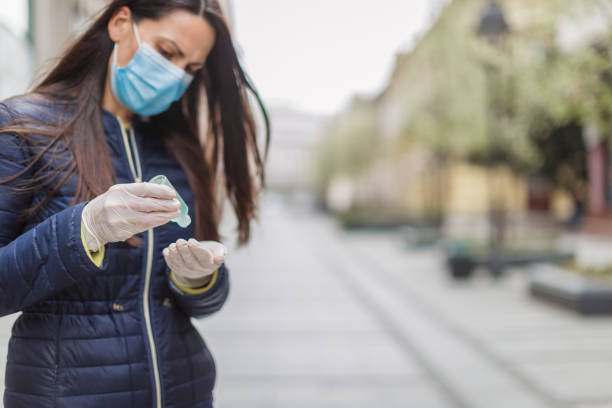 istock Young woman with a face protective mask 1216006021