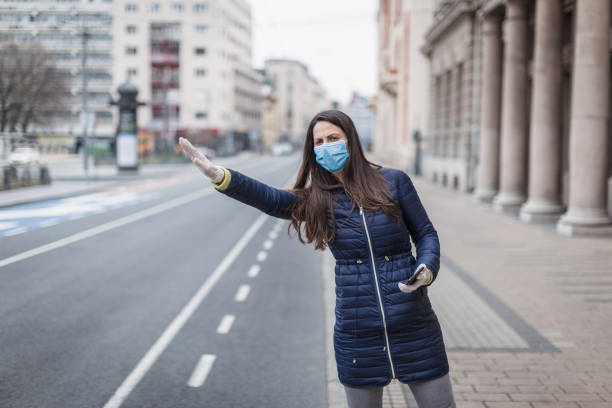 istock Young woman with a face protective mask 1216007361