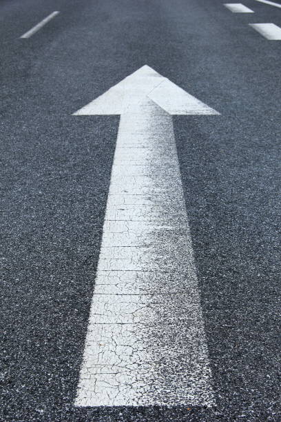 istock Asphalt road with arrow 1216007519