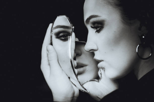 istock Woman with depression mirror, black and white portrait 1216010157