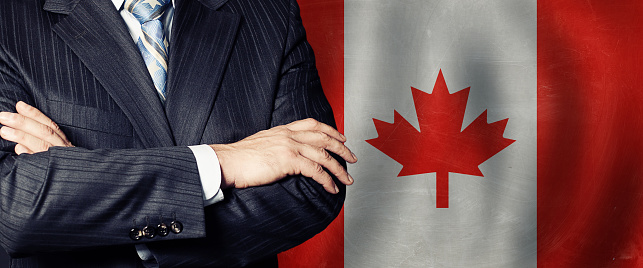 Politician  crossed arms of on Canada flag background