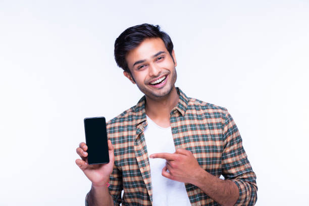 istock Young man showing a phone stock photo 1216013120
