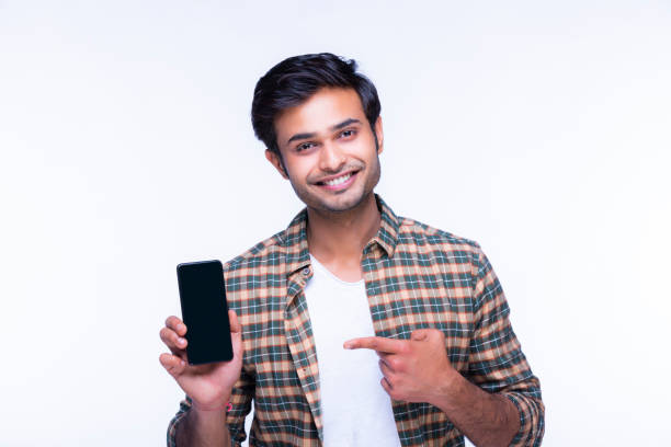 istock Young man showing a phone stock photo 1216013229