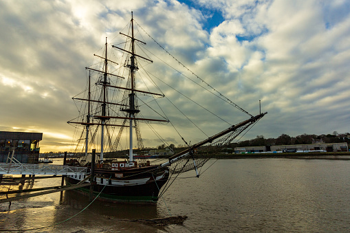 New Ross, Ireland - January 22, 2019 - A replica of the Dunbrody Famine Ship is moored on the banks of River Barrow. It is a popular tourist attraction in the town.