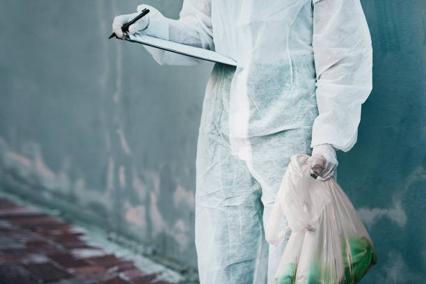Disease takes a day off when he's around Cropped shot of a healthcare worker wearing a hazmat suit working to control an outbreak biohazard cleanup stock pictures, royalty-free photos & images