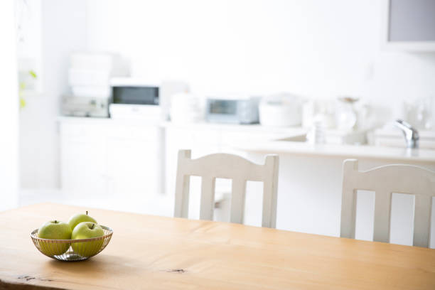 istock Wooden table and green apples 1216016863