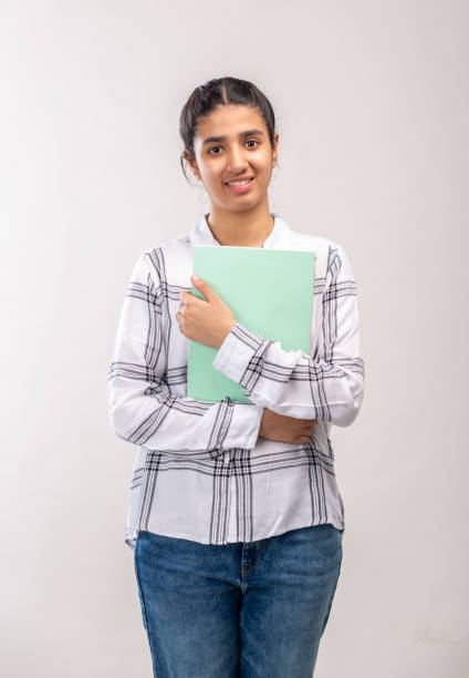 young student girl standing with books