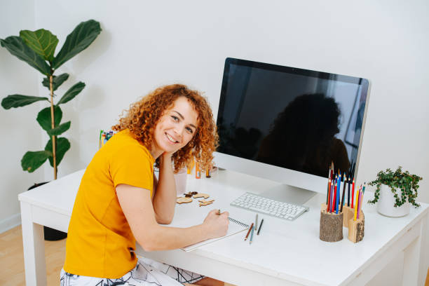 istock Creative woman working remotely in her home office 1216020541