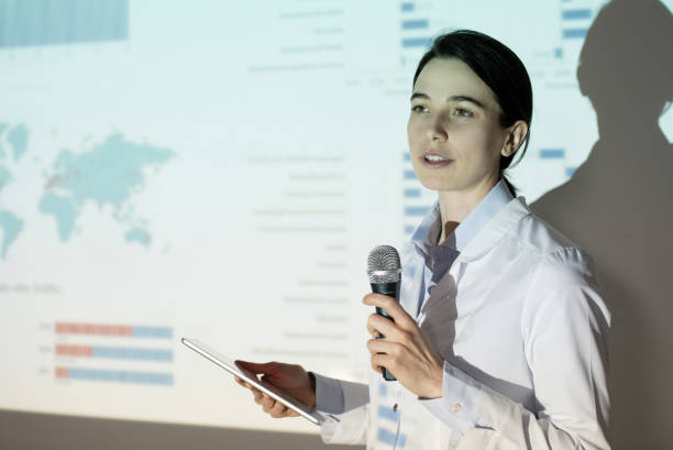 istock Young woman at medical convention 1216021465