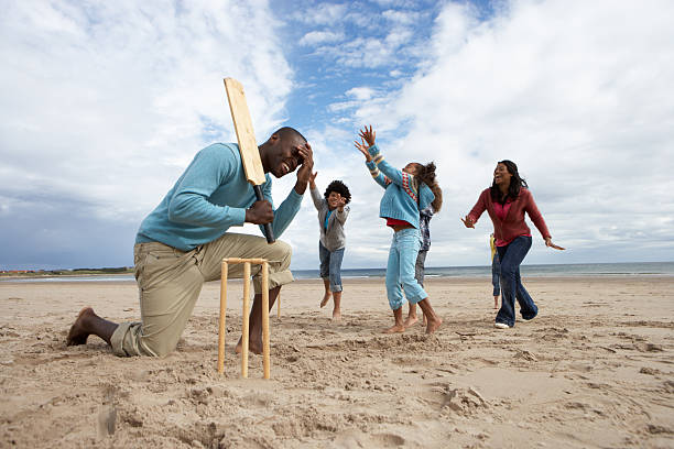 istock Family playing cricket on beach 121602209