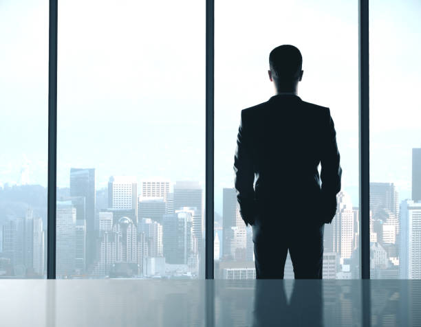 istock Businessman standing in office 1216022227