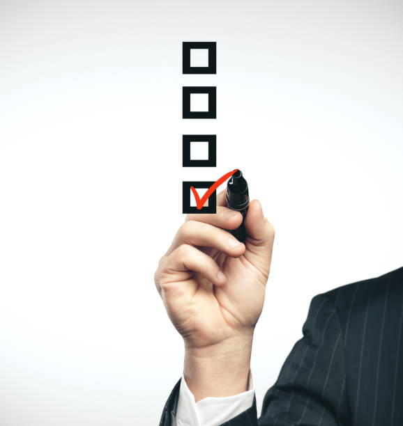 istock Businessman hand drawing check box 1216022279
