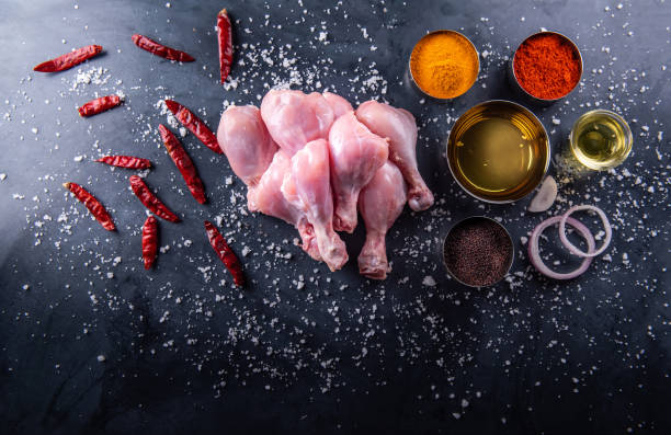 istock Raw chicken on the table top in the kitchen. 1216022320