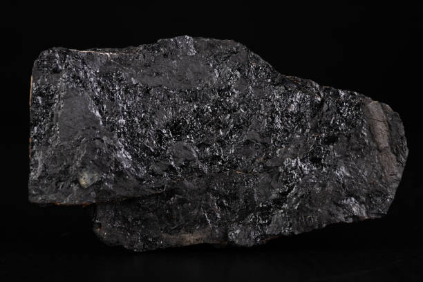istock Lignite lump. Carbon as an energy source. Dark background. 1216022424