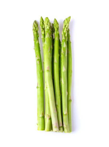 istock Asparagus isolated on white background. top view 1216022770
