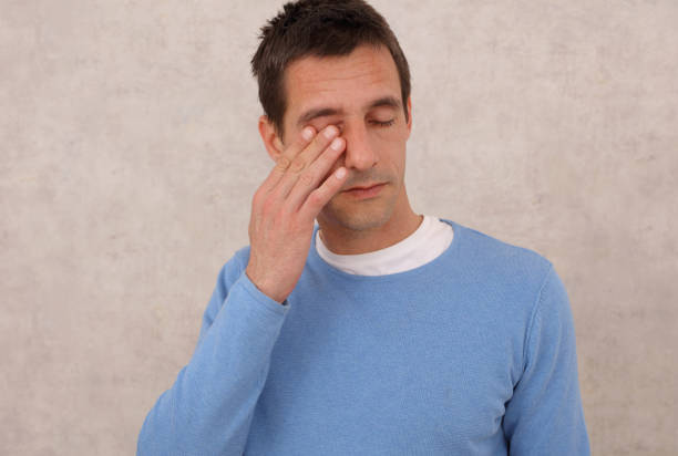 istock Man touching is face, eyes. Coronavirus Prevention, New habits, Self-isolation , Quarantine 1216022892