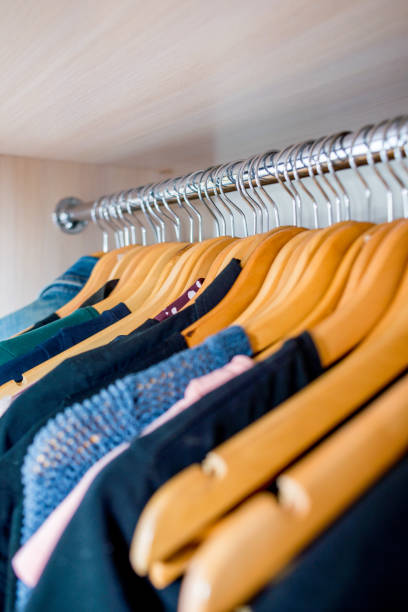 istock Lot of different clothes on hangers. Copy space 1216022918