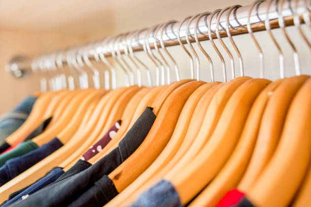 istock Lot of different clothes on hangers. Copy space 1216022936