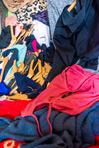 istock pile of used clothes. Second hand for recycling 1216022941