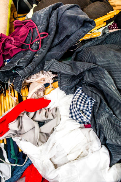 istock pile of used clothes. Second hand for recycling 1216022949