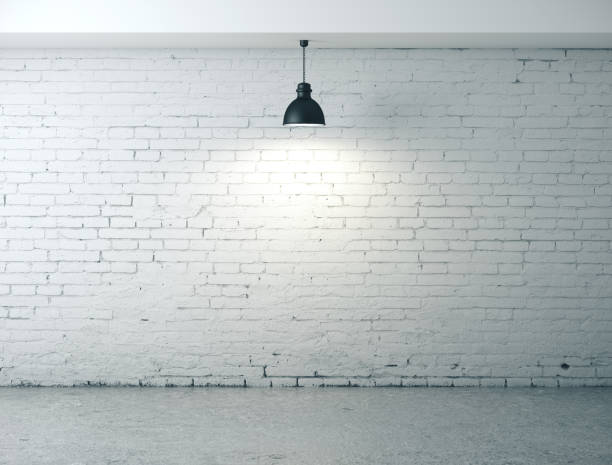 istock room with blank wall, lamp and concrete floor 1216024344