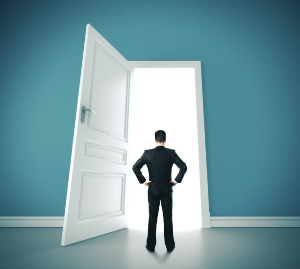 istock Businessman standing in blue room 1216024474