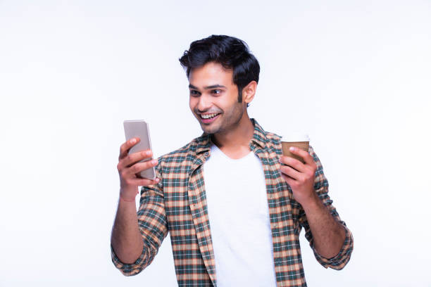 istock Indian man using mobile phone. stock photo 1216024580