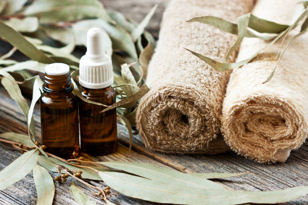 Spa composition with  eucalyptus essential oil and bath towels, selective focus with shallow depth of field