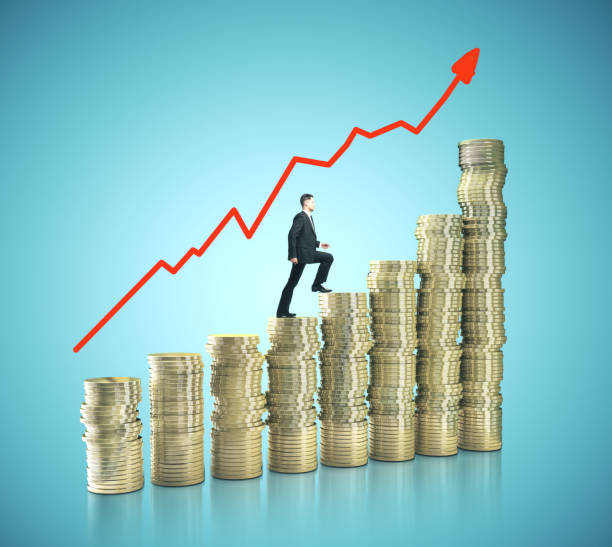istock Businessman on gold coins in form chart 1216024650