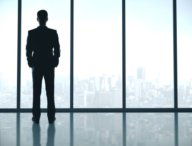 istock Businessman standing in office 1216025557