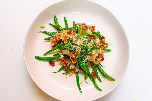 Green beans salad Green beans, caramelized onion, bacon , vinaigrette, and manchego  cheese runner bean stock pictures, royalty-free photos & images