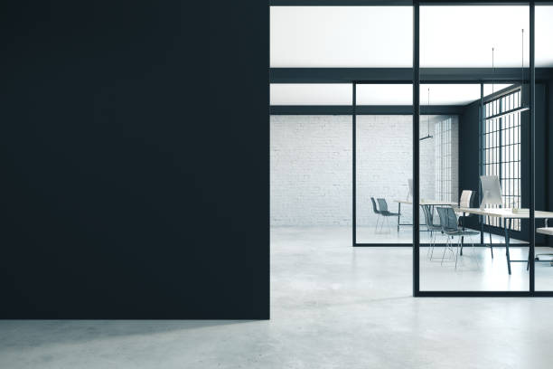 istock Coworking office interior with blank black wall a 1216026258