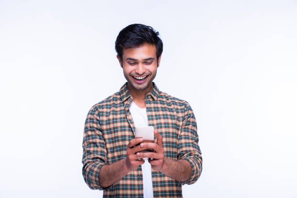 Indian man using mobile phone. stock photo