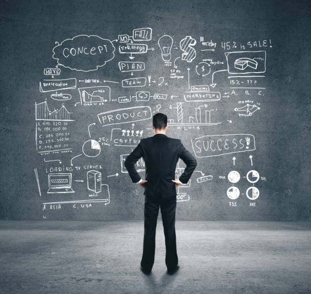 istock Businessman looking on business plan 1216027578