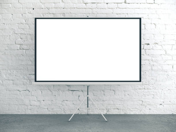Blank white poster in brick interior room.