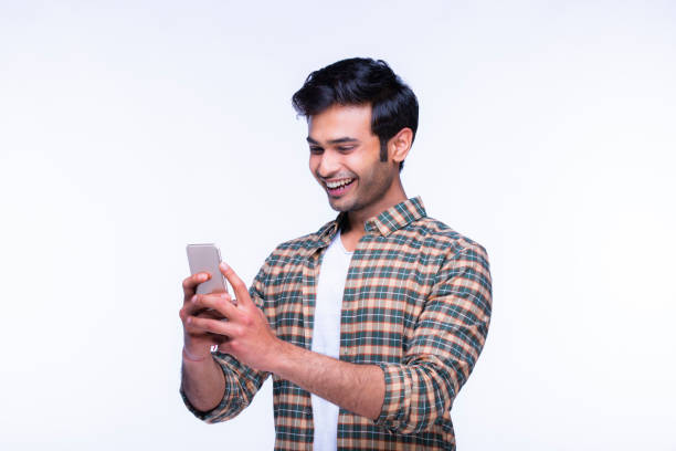 istock Indian man using mobile phone. stock photo 1216027675
