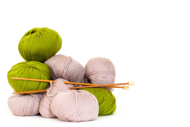 istock Balls of wool with bamboo knitting needles, white bcakground with copy space 1216028505