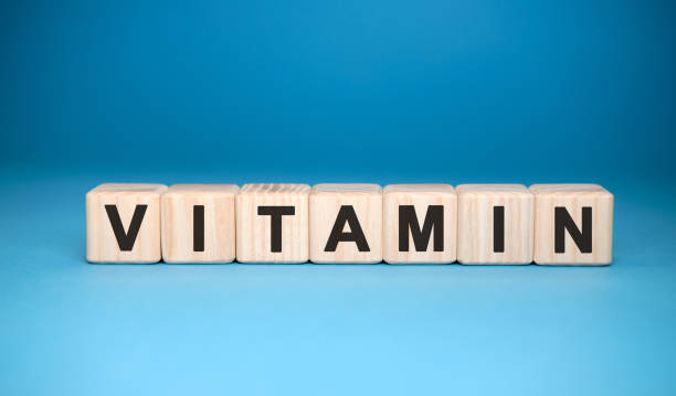 istock VITAMINS word cube on a blue background. Medical concept. 1216028724