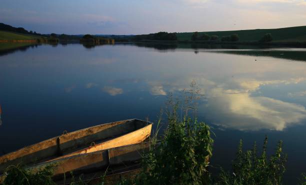 istock Boat on Hungarian lake at sunset time. 1216028935