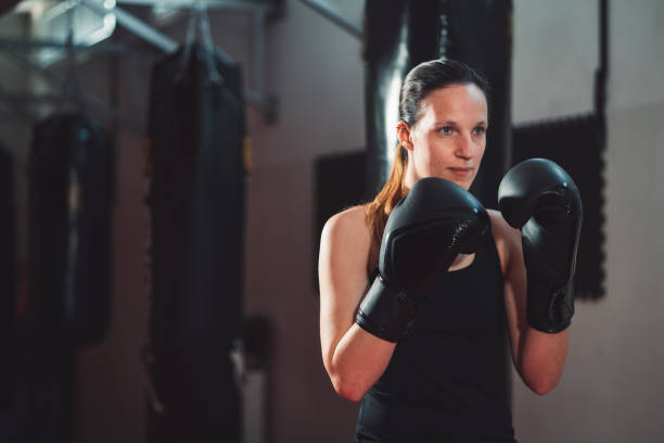 istock Woman boxer wearing boxing gloves 1216029028