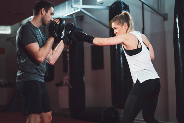 istock Strong woman on a boxing lesson 1216029055