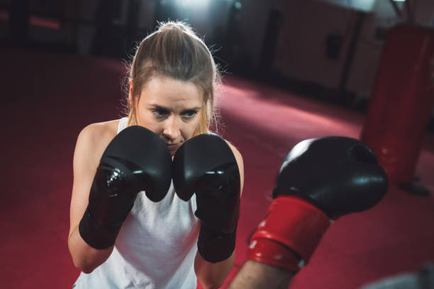 istock Strong blonde woman training box with a partner 1216029069