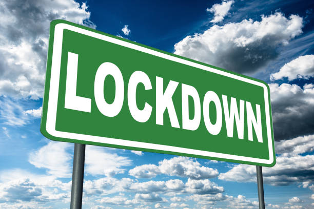 istock lock down street sign against the sky 1216029249