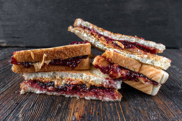 istock messy peanut butter and jelly sandwiches cut in half in stack 1216030645