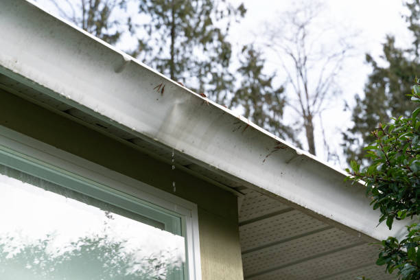 istock Old and bent exterior house gutter 1216031576