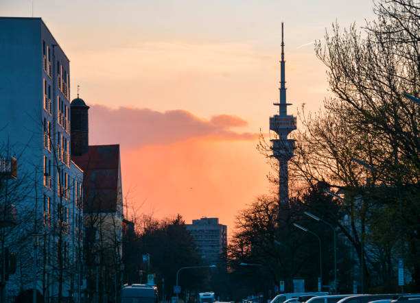 pink and orange sunset in munich, olympic tower in background
